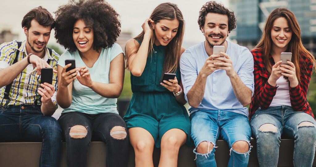 Photo of teenagers on their phones||LinkedIn logo - Optimal sizes for images on LinkedIn|||